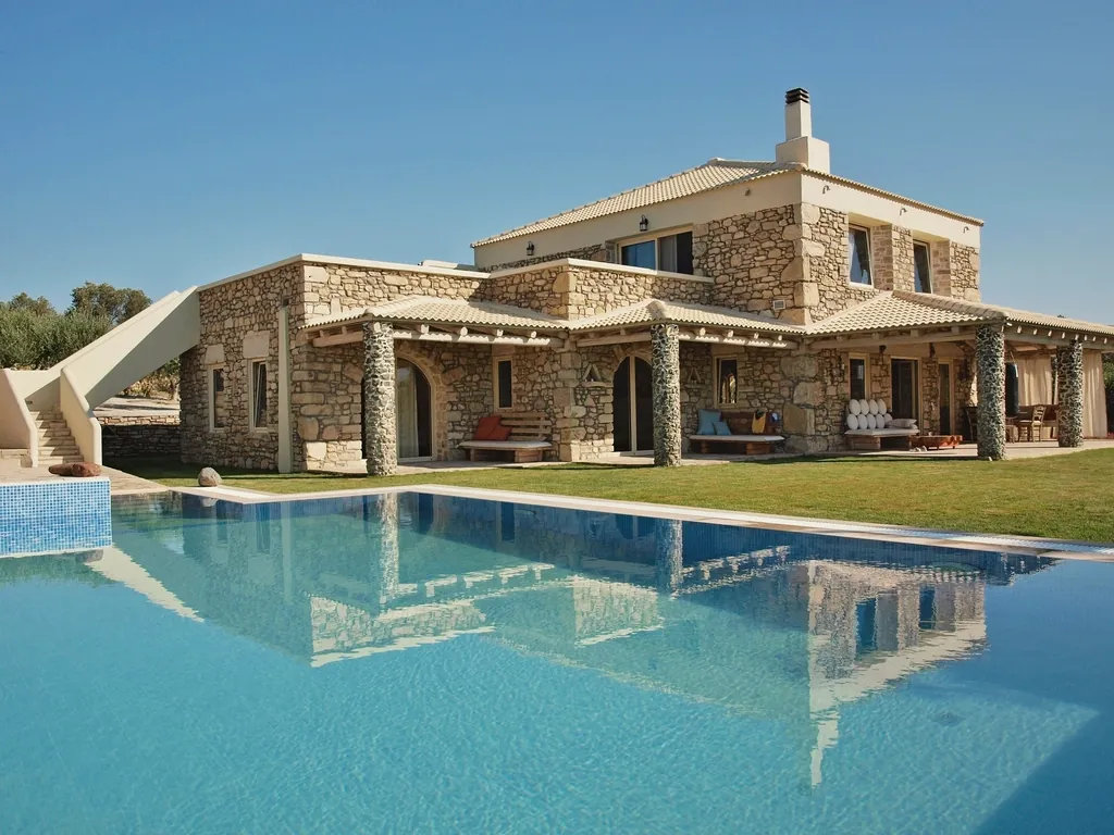A Mediterranean estate home with a pool